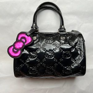 Lounge Fly & Hello Kitty black faux patent leather handbag w face imprint & tag